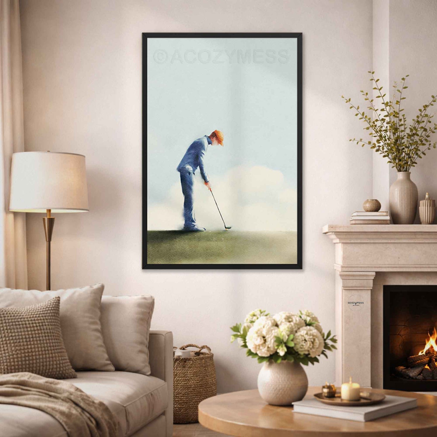 Framed artwork of a golfer on a wall in a living room with a fireplace and decor.