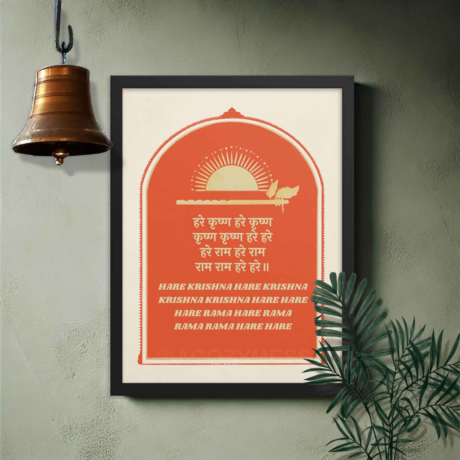 Hare Krishna poster in red and beige, featuring text in both English and Hindi, framed in black on a temple wall.