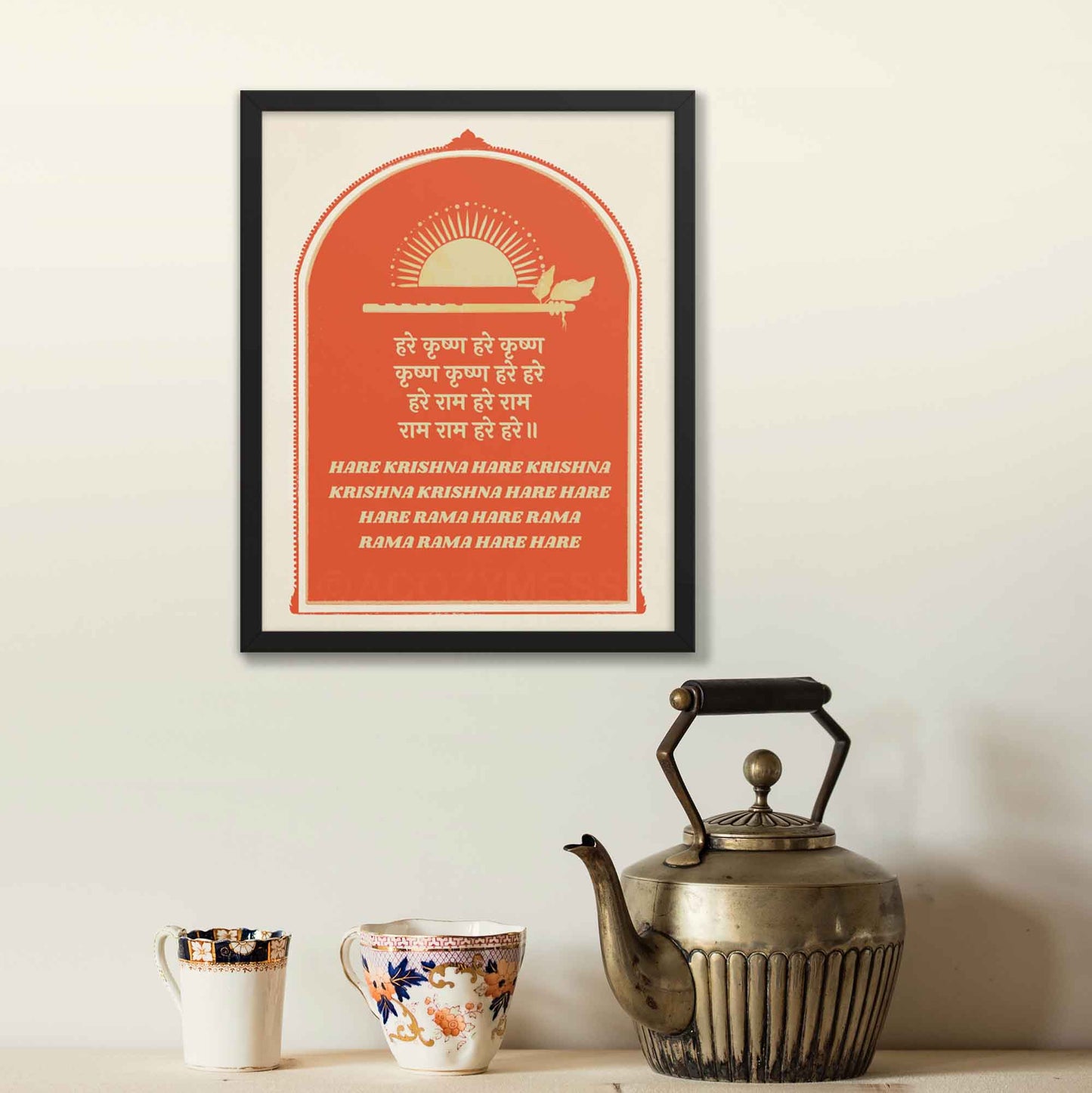 Hare Krishna poster in red and beige, featuring text in both English and Hindi and flute and sun illustration symbolizing lord Krishna, framed in black as a spiritual wall art.