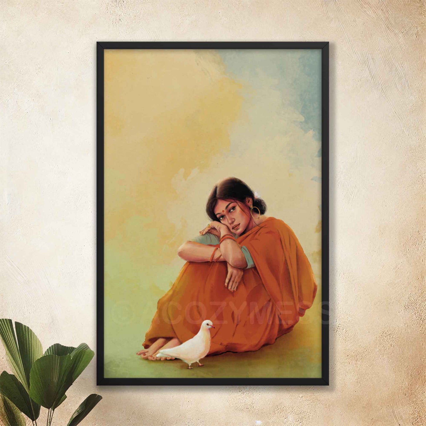 Indian woman sitting in a red saree with white dove wall art poster in black frame.