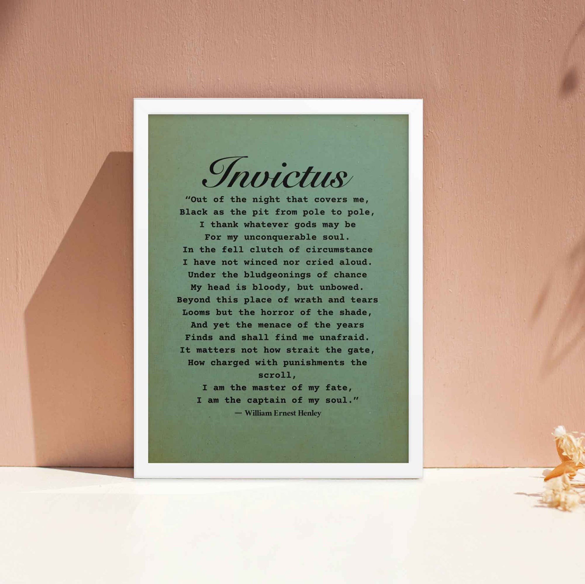 Invictus Poem Poster black on green displayed in white  frame.