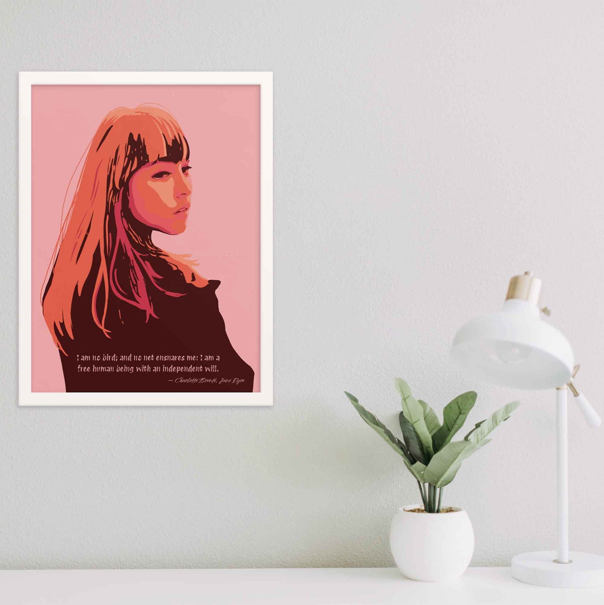 Art print of a woman in pink, orange, and brown tones with a quote from Jane Eyre reading 'I am no bird; and no net ensnares me; I am a free human being, with an independent will,'  in white frame