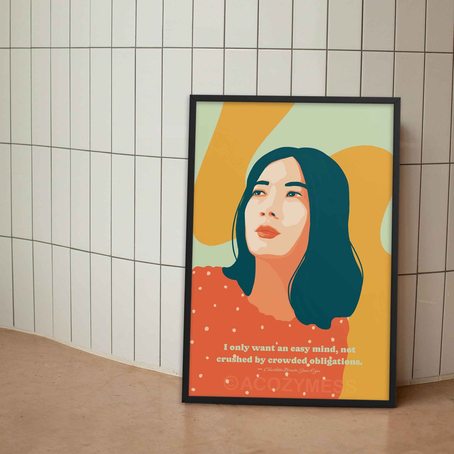 Orange, Yellow and green art print of a woman, featuring a quote from Jane Eyre: 'I only want an easy mind, not crushed by crowded obligations' in black frame