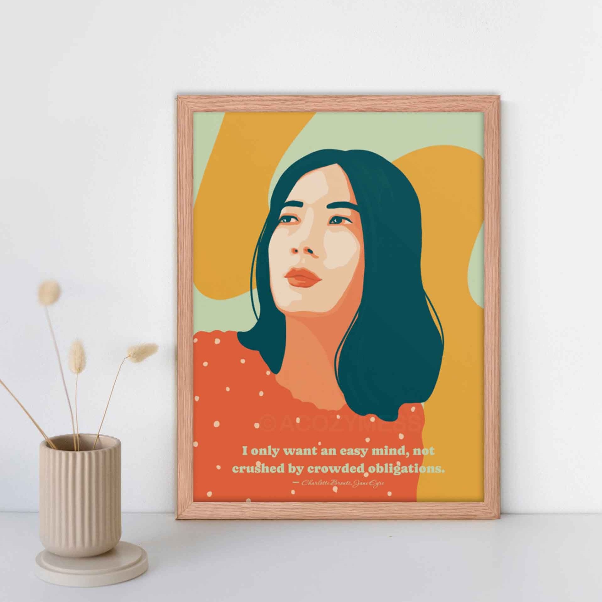 Vibrant and colorful art print of a woman, featuring a quote from Jane Eyre: 'I only want an easy mind, not crushed by crowded obligations,' in oakwood frame.