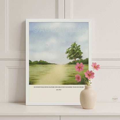 White framed John Muir quote poster reading “In every walk with nature,” paired with a serene green landscape design.