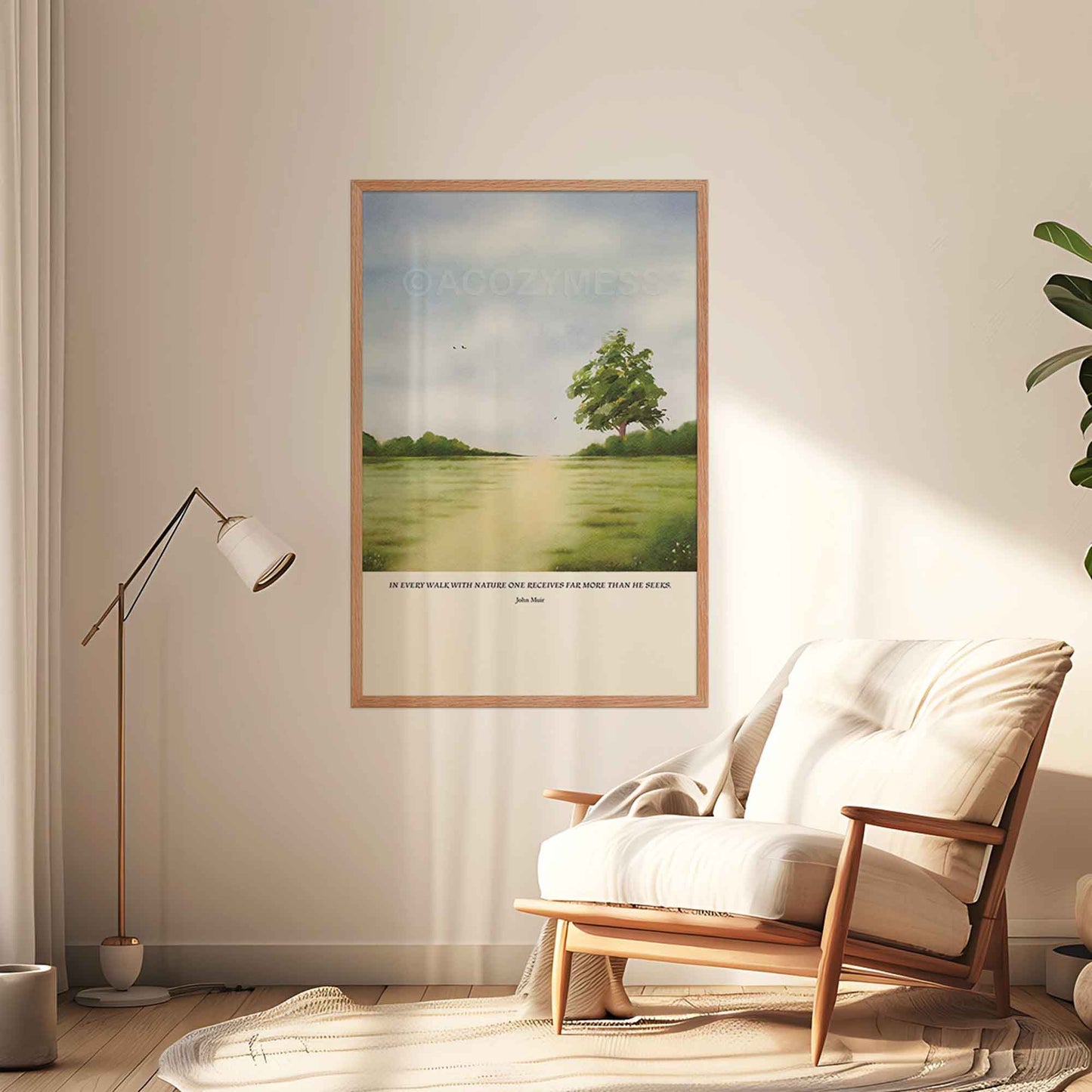 John Muir nature quote wall art displayed in an oakwood frame, showing a calming green landscape illustration hanging on a living room wall