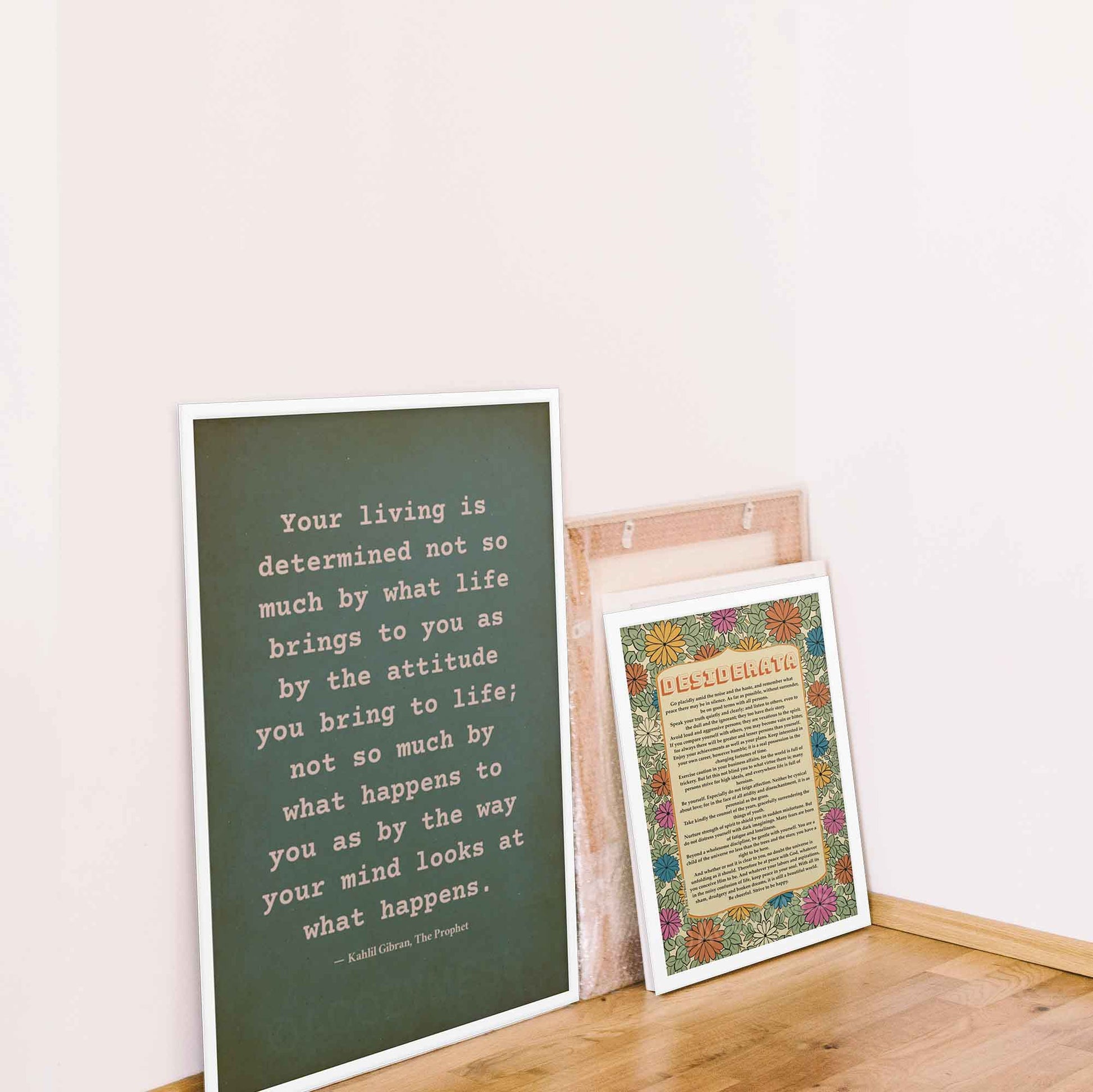 On attitude By kahlil gibran poster beige on textured green, displayed in white frame. And desiderata Poster in white frame.