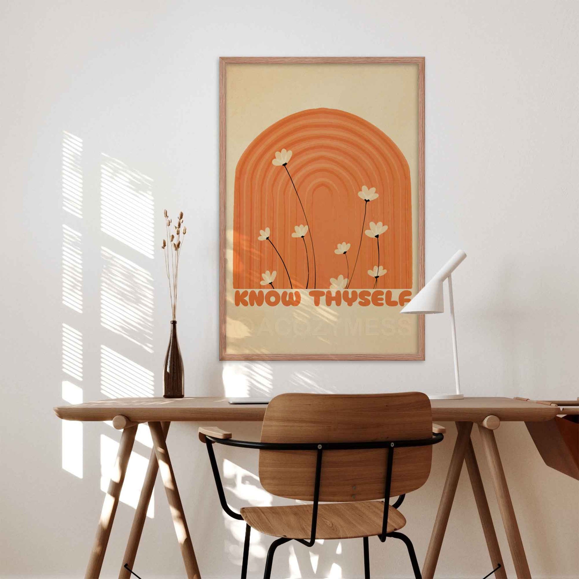 Know Thyself art poster with a boho design in beige and orange tones, inspired by Greek philosophy, perfect for adding wisdom and charm to your space, in oakwood frame on a desk wall.