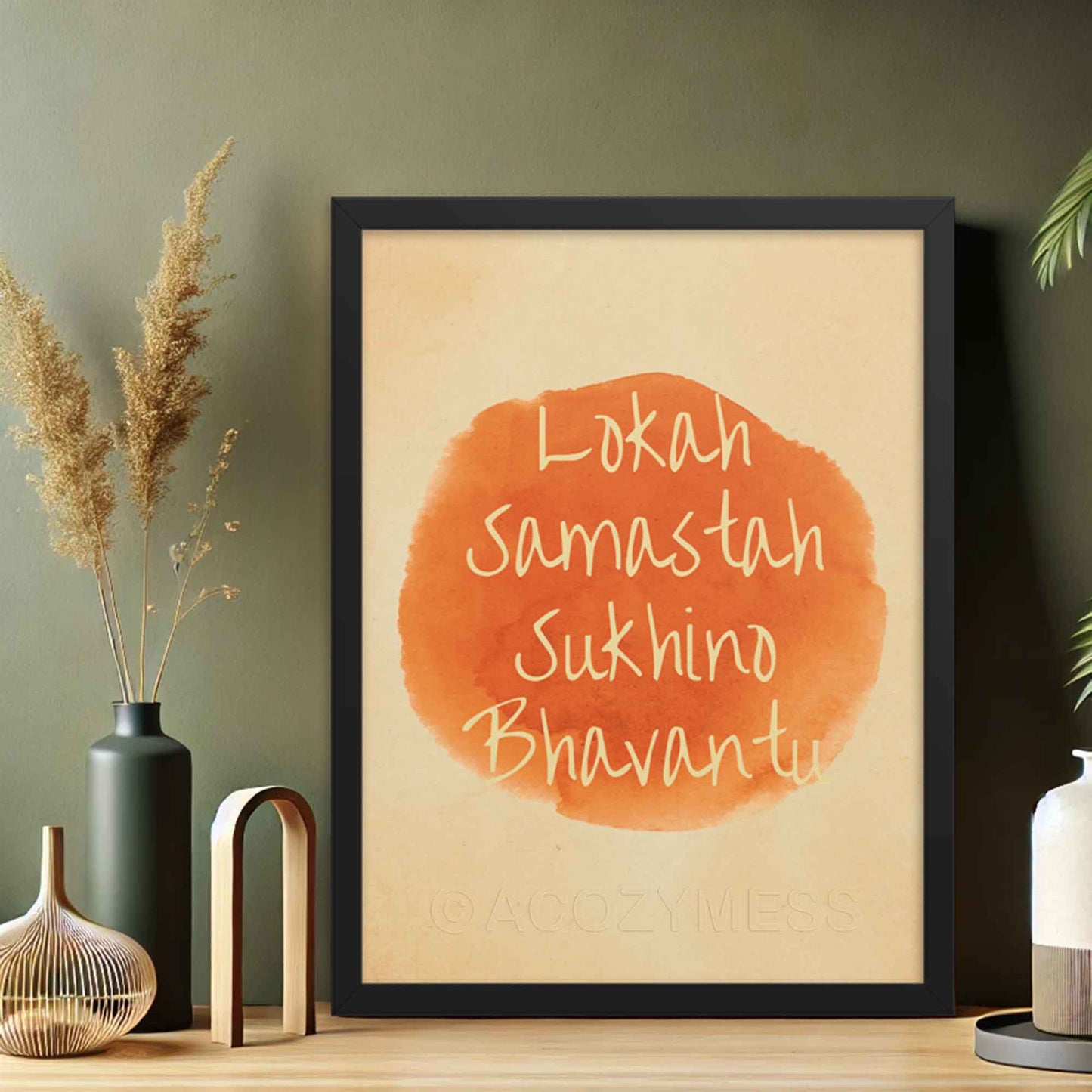 Art print featuring the mantra 'Lokah Samastah Sukhino Bhavantu,' created in watercolors and finished on iPad in orange and beige tones in black frame.