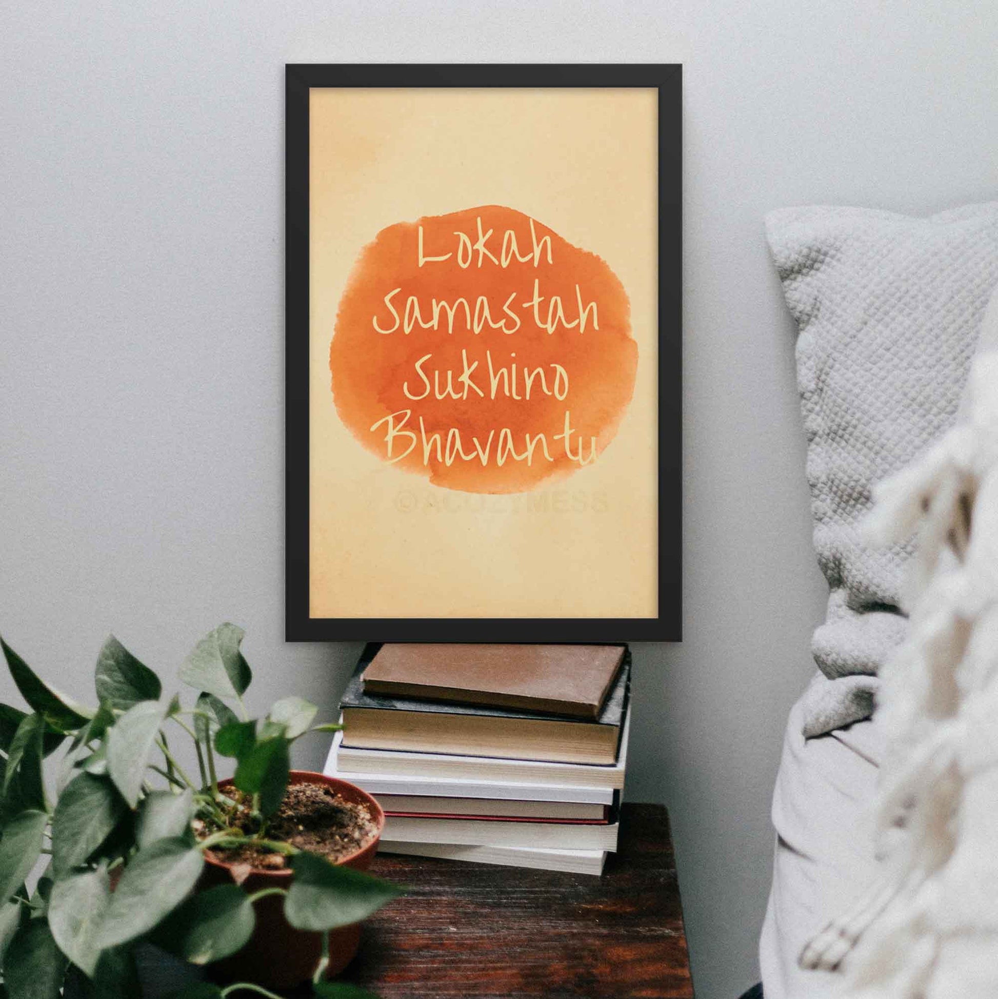 Art print featuring the mantra 'Lokah Samastah Sukhino Bhavantu,' created in watercolors and finished on iPad in orange and beige tones in 12x18 black frame.