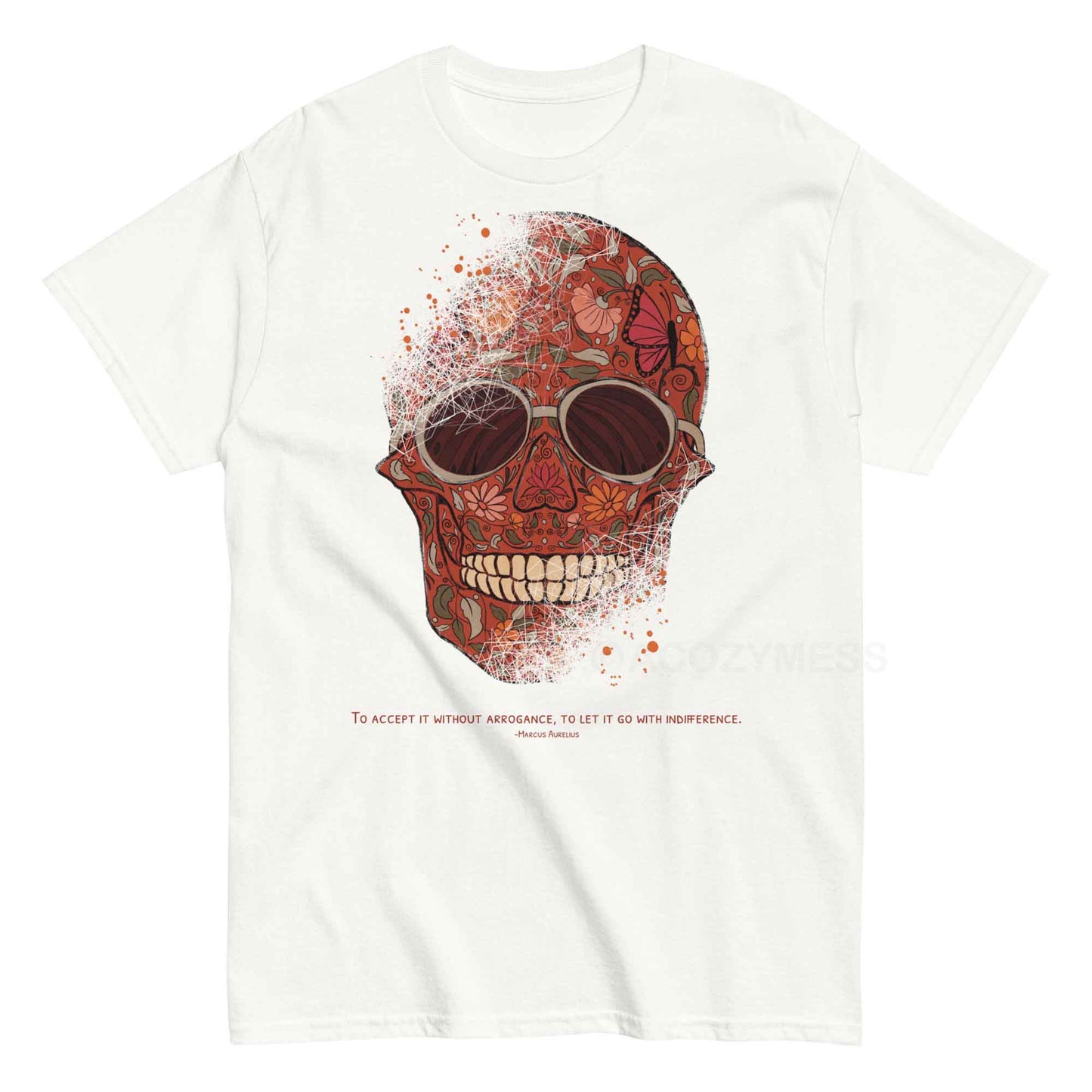 A white T-shirt featuring a detailed skull and floral design, paired with a Marcus Aurelius quote: "To accept it without arrogance, to let it go with indifference." The artwork symbolizes memento mori and Stoic philosophy, blending mortality with beauty.