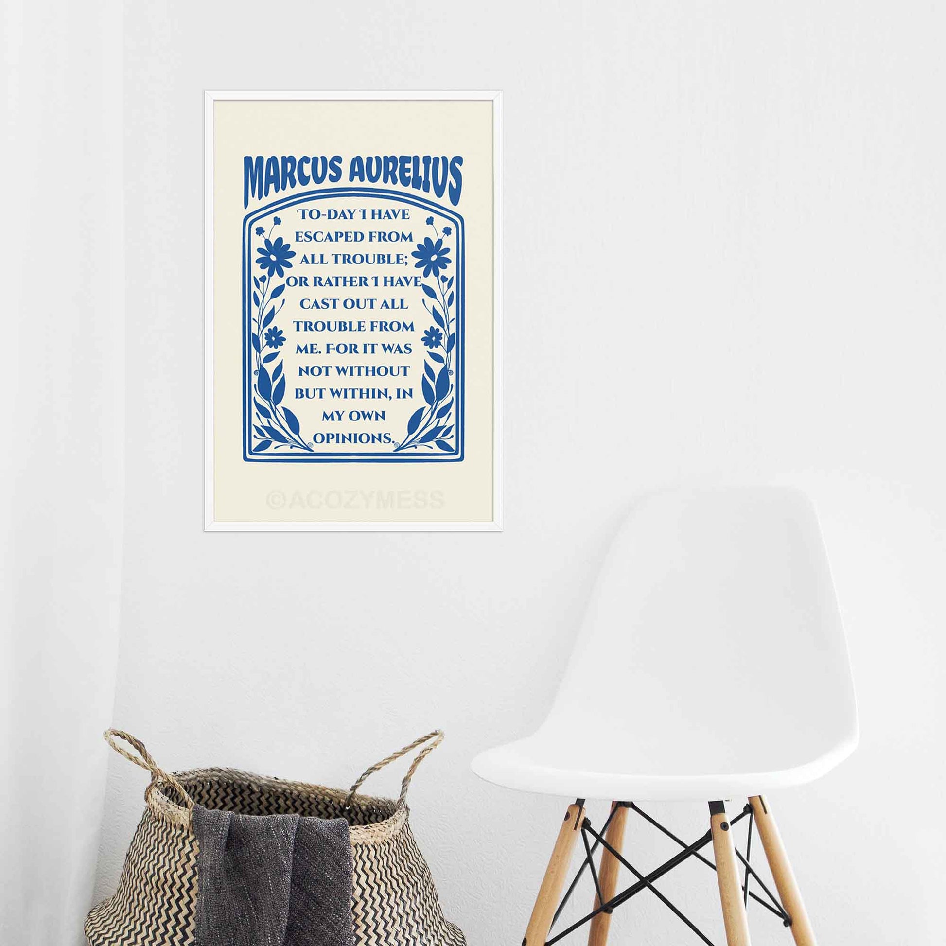 Marcus Aurelius print dark blue on cream with floral design, in white frame.