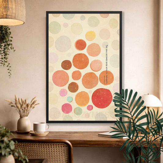 Black Framed abstract art print with colorful circles and Marcus Quote on a wall above a wooden console table.