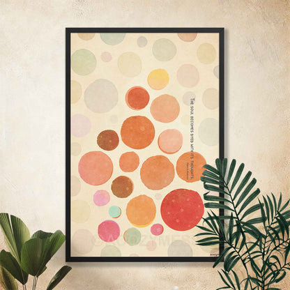 Black Framed abstract art print with colorful circles and Marcus aurelius on soul and thoughts quote on a beige background, placed on a wall.