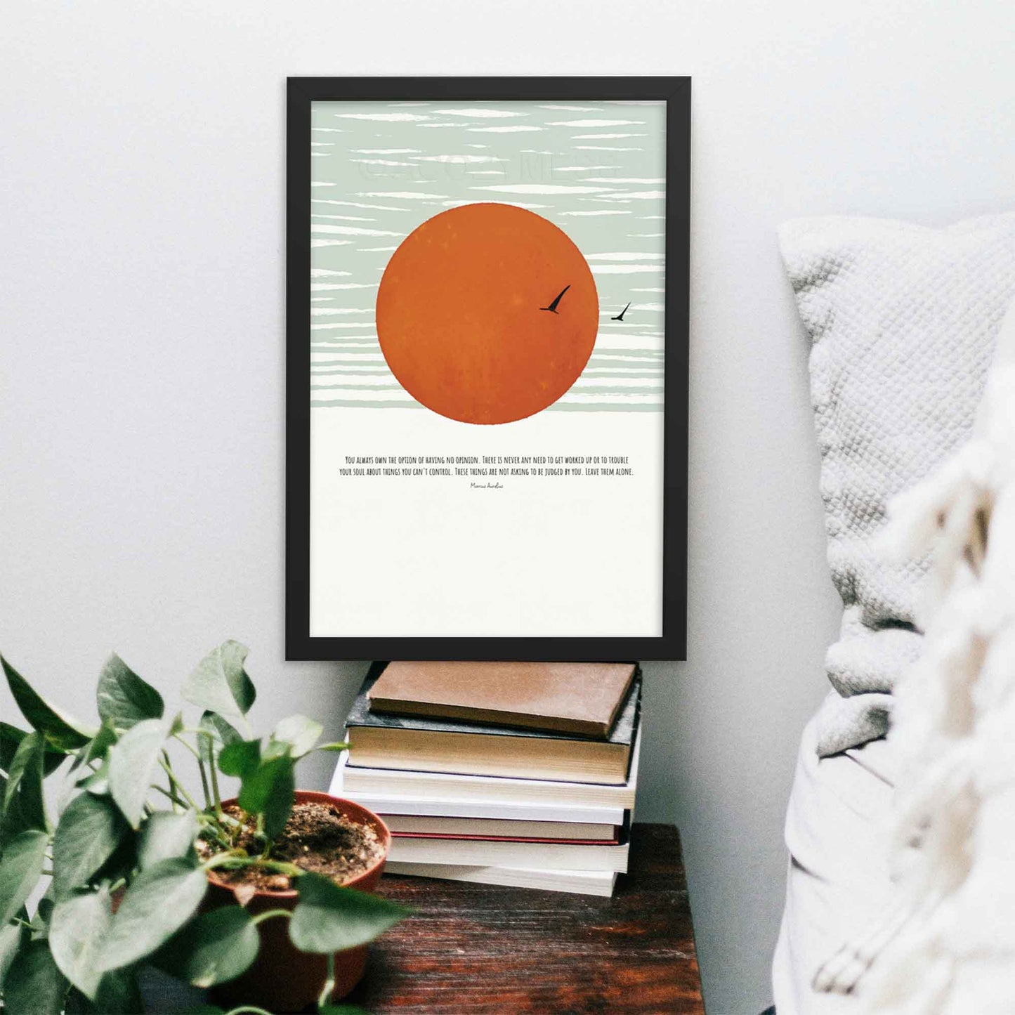 Marcus Aurelius Poster with quote on opinion with art of flying birds and sun in blue abstract sky, in black frame.