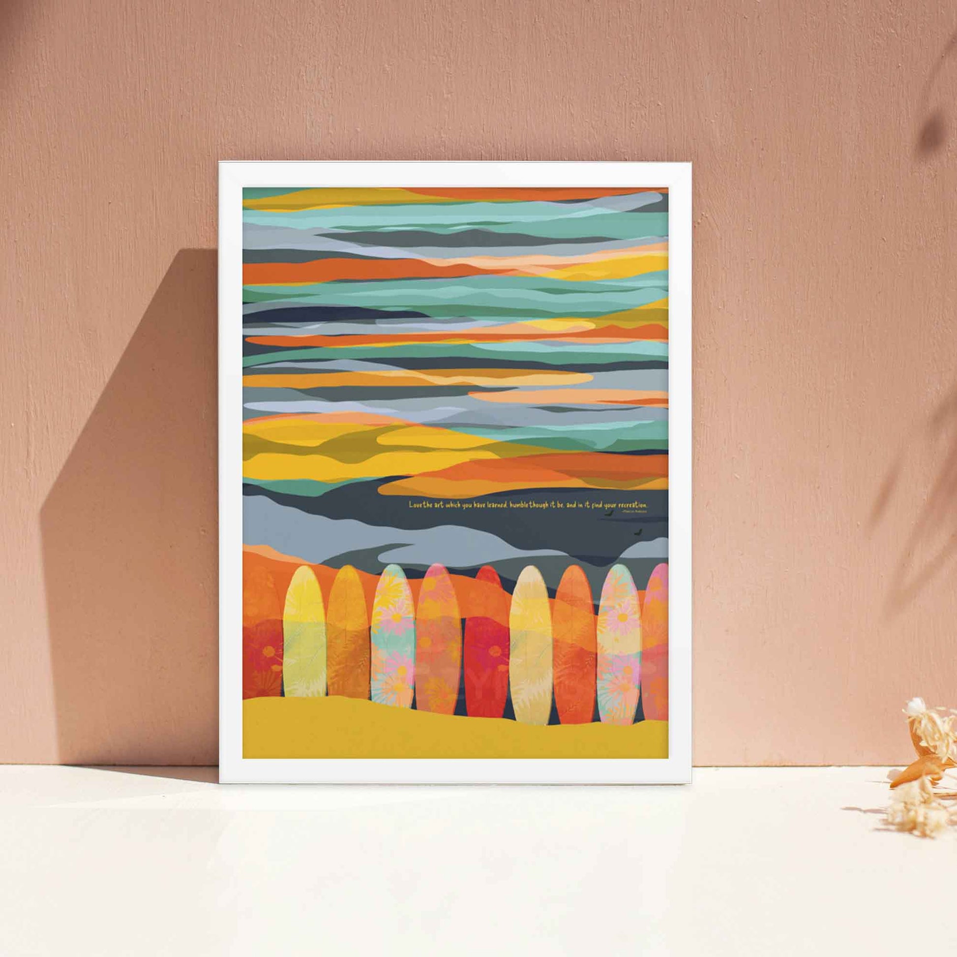 Colorful sky & surfing board illustration with Marcus Aurelius print quote on love of ones art, displayed in white frame.