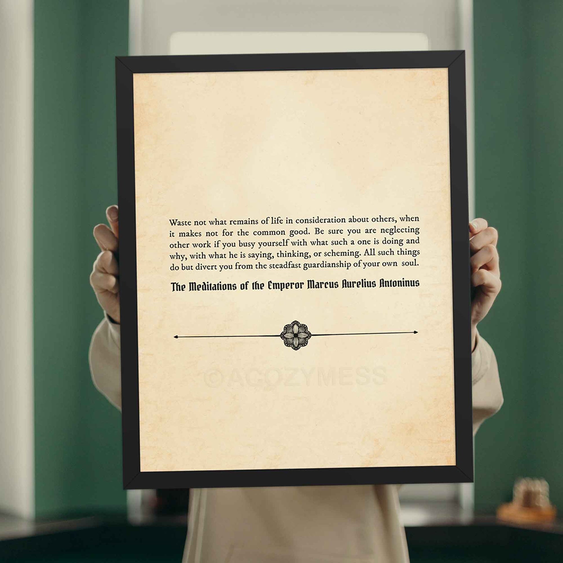 A vintage-style stoic quote  poster featuring a Marcus Aurelius quote on an aged book paper background in black frame.