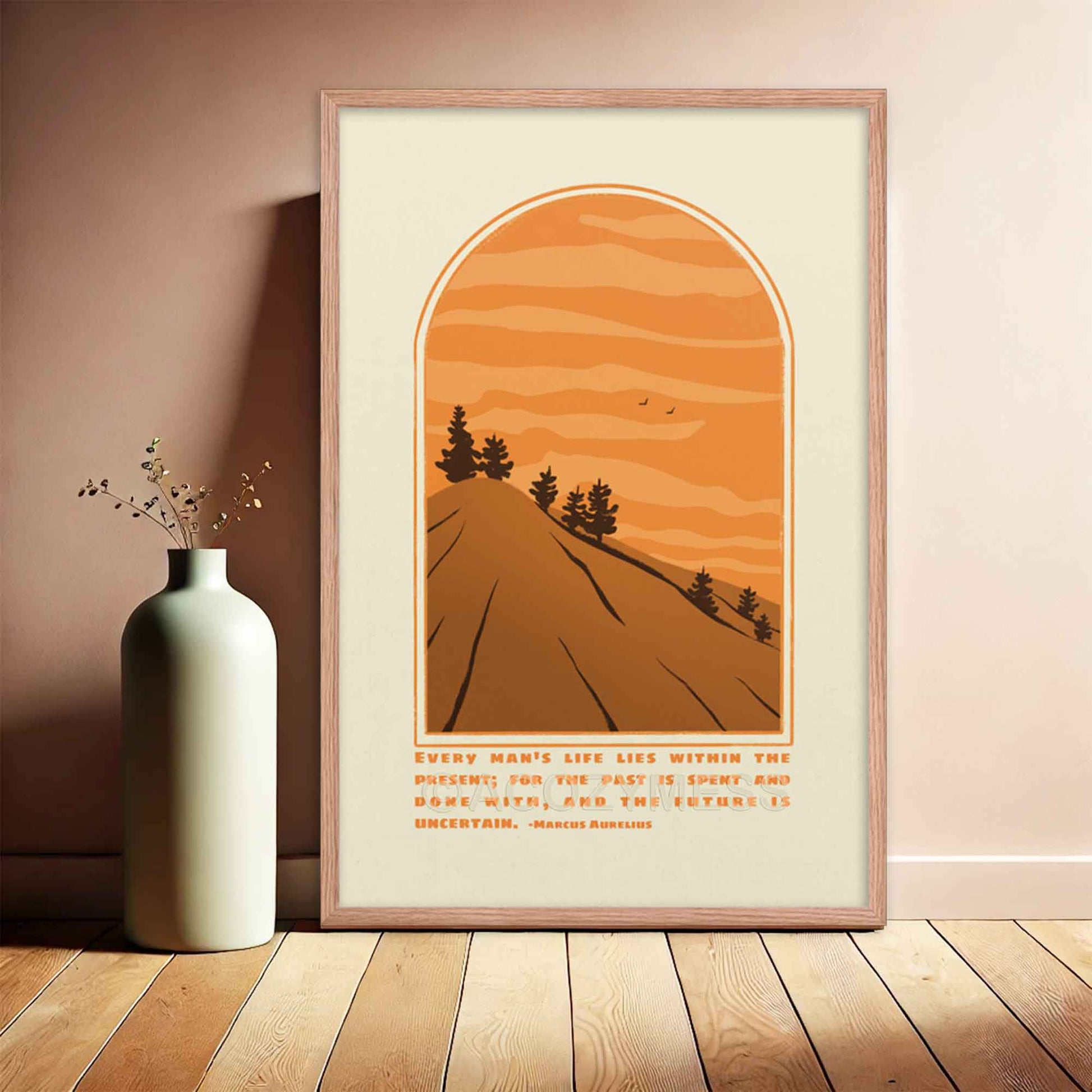 Marcus Aurelius Poster with quote on present moment with an illustration of a scenic mountain  view in beige, brown and orange colors displayed in oakwood frame.