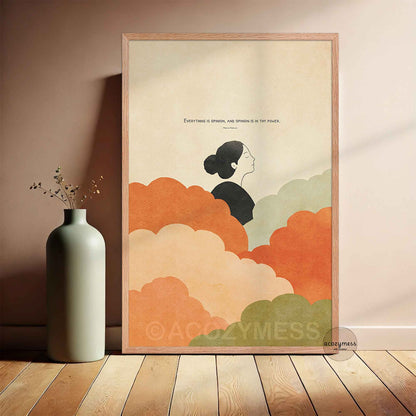 Oakwood Framed poster with a stylized illustration of a woman and colorful clouds on a beige background, placed on a wooden floor next to a vase.