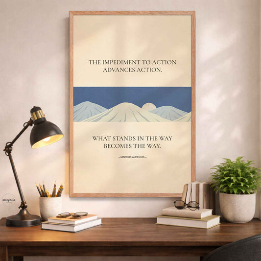 Framed artwork with mountain design and inspirational stoic quote on a desk.