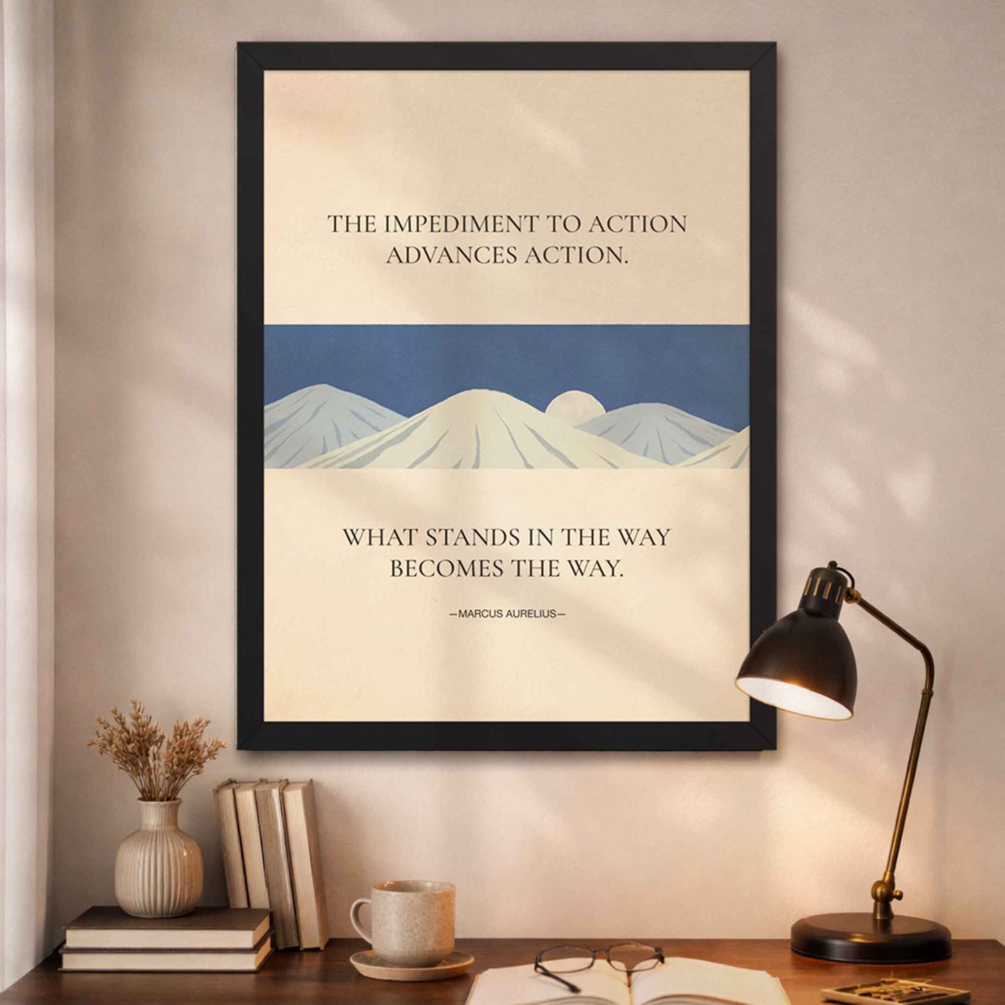 Marcus Aurelius quote poster in black frame with beige background and blue mountains