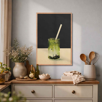 Oakwood-framed matcha latte wall art with boba pearls in a glass on a dark gray and beige background.