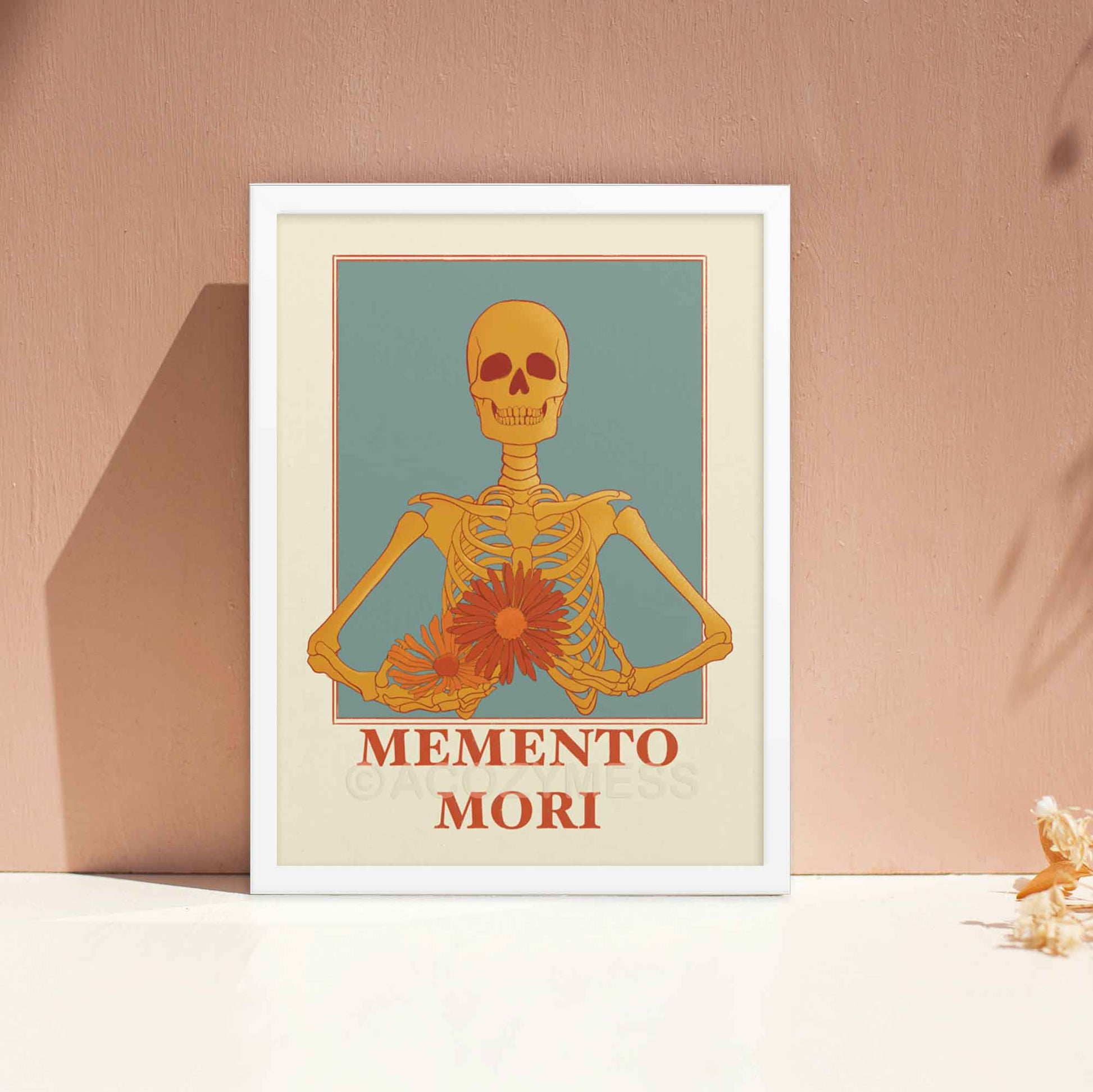 A memento mori art piece in beige blue, yellow & orange hues, featuring a skeleton carrying colorful flowers in white frame