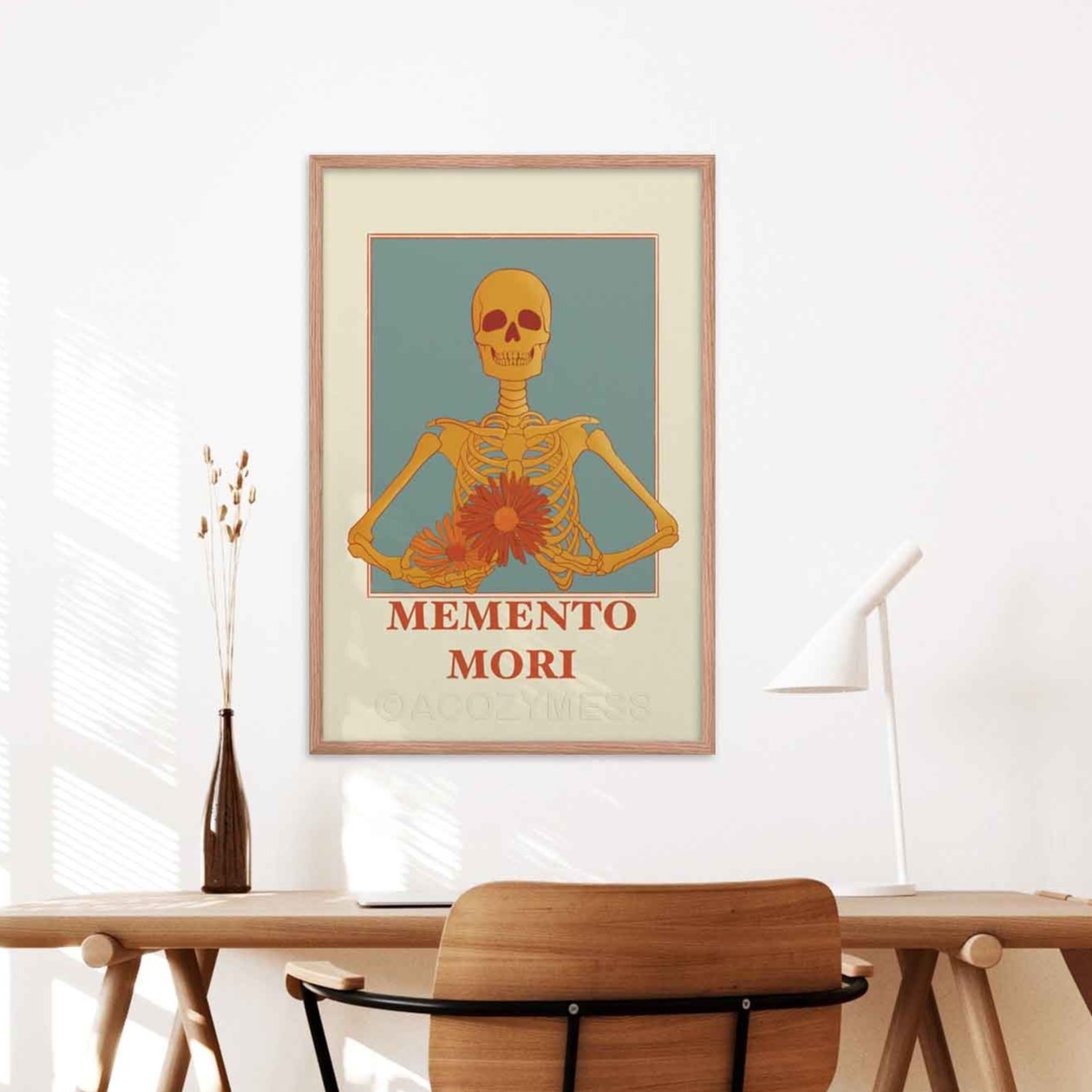 A memento mori art piece in beige blue, yellow & orange hues, featuring a skeleton carrying colorful flowers in oakwood frame