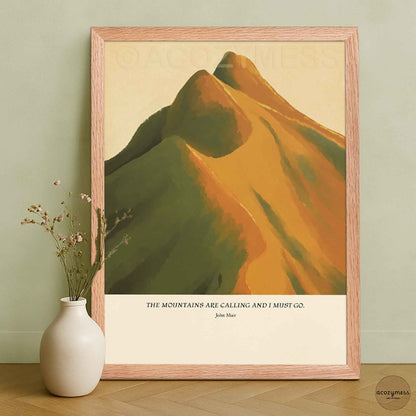 John Muir mountain quote wall art displayed in an oakwood frame, showing mountains illustrated in warm earthy hues.