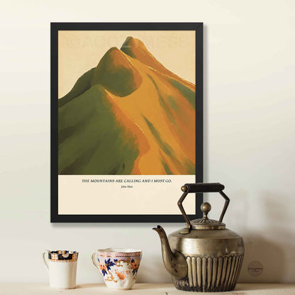 Black framed John Muir quote poster with “The mountains are calling and I must go,” paired with warm mountain artwork.