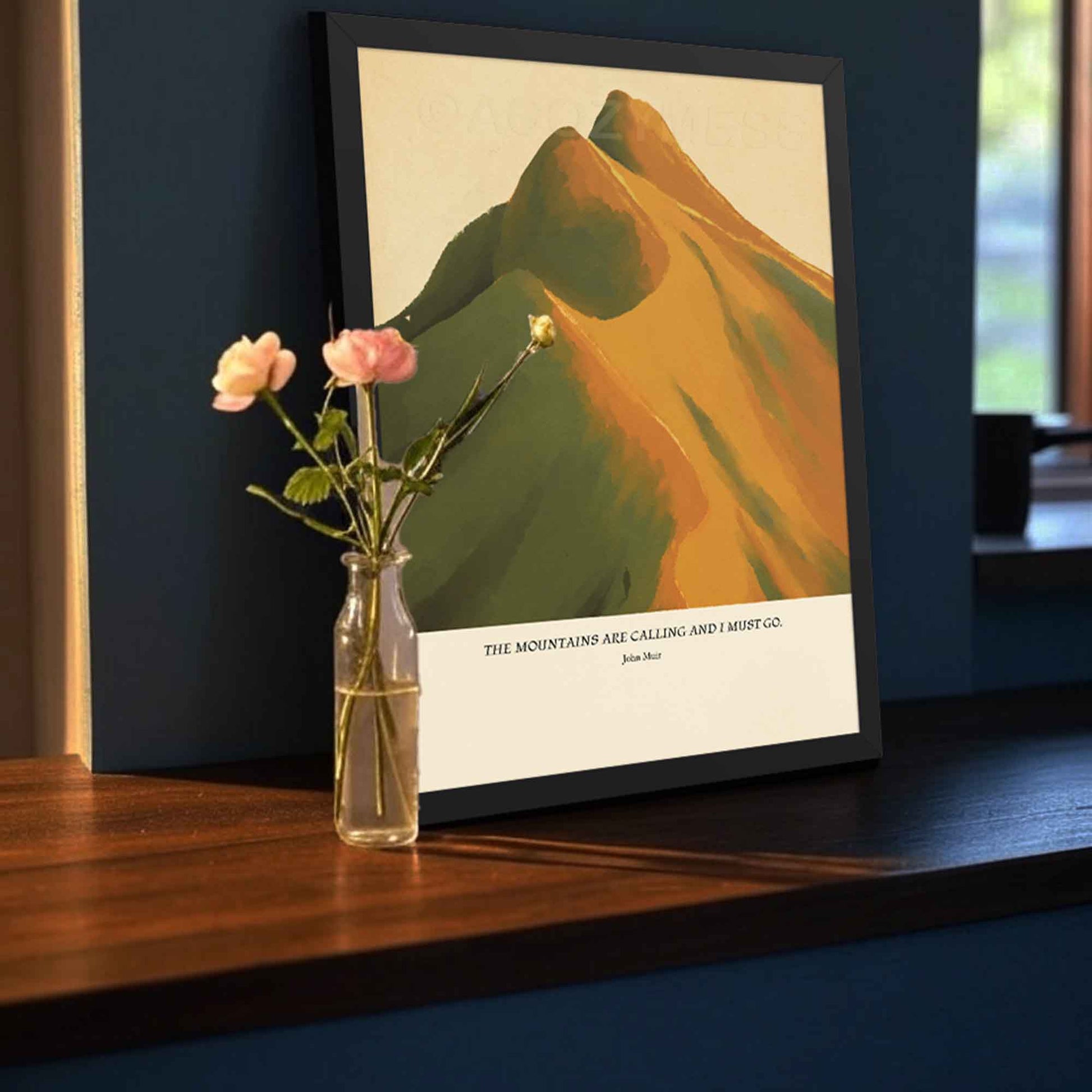 John Muir inspirational mountain quote wall art presented in a black frame, with a warm-hued scenic landscape illustration