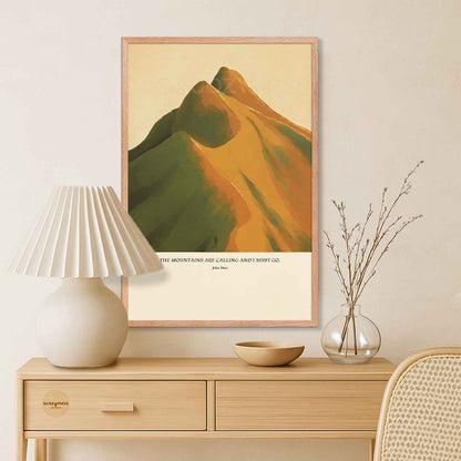 John Muir inspirational mountain quote wall art presented in a oakwood frame, with a warm-hued scenic landscape.