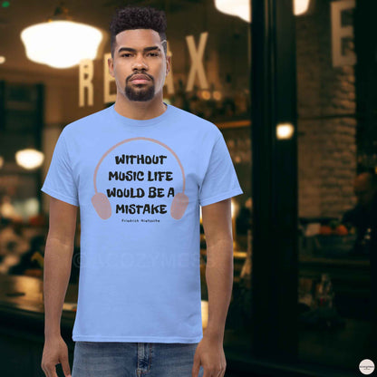 A man wearing carolina blue t-shirt featuring the quote "Without music, life would be a mistake" by Friedrich Nietzsche in a playful, eye-catching font. 