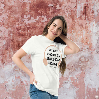 A woman wearing white t-shirt featuring the quote "Without music, life would be a mistake" by Friedrich Nietzsche in a playful, eye-catching font. 
