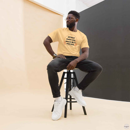 A man wearing yellow t-shirt featuring the quote "Without music, life would be a mistake" by Friedrich Nietzsche in a playful, eye-catching font. 