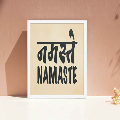 A white-framed typography poster featuring the word Namaste in both Hindi (नमस्ते) and English, displayed in bold black font on a beige background. The minimalist design symbolizes peace, respect, and spiritual connection, making it ideal for yoga studios and mindful spaces.