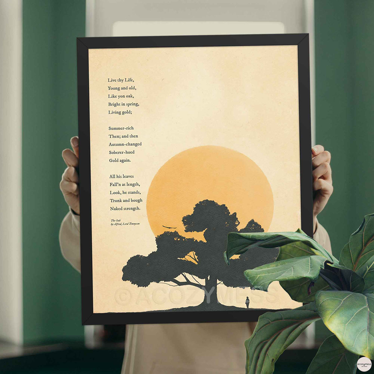 The Oak poetry poster by Alfred Lord Tennyson in a sleek black frame, showcasing a dark silhouette of an oak tree against an amber sun and warm textured background.