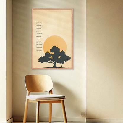 The Oak poetry poster by Alfred Lord Tennyson in a frame, showcasing a dark silhouette of an oak tree against an amber sun and warm textured background, displayed on a warm cream wall.