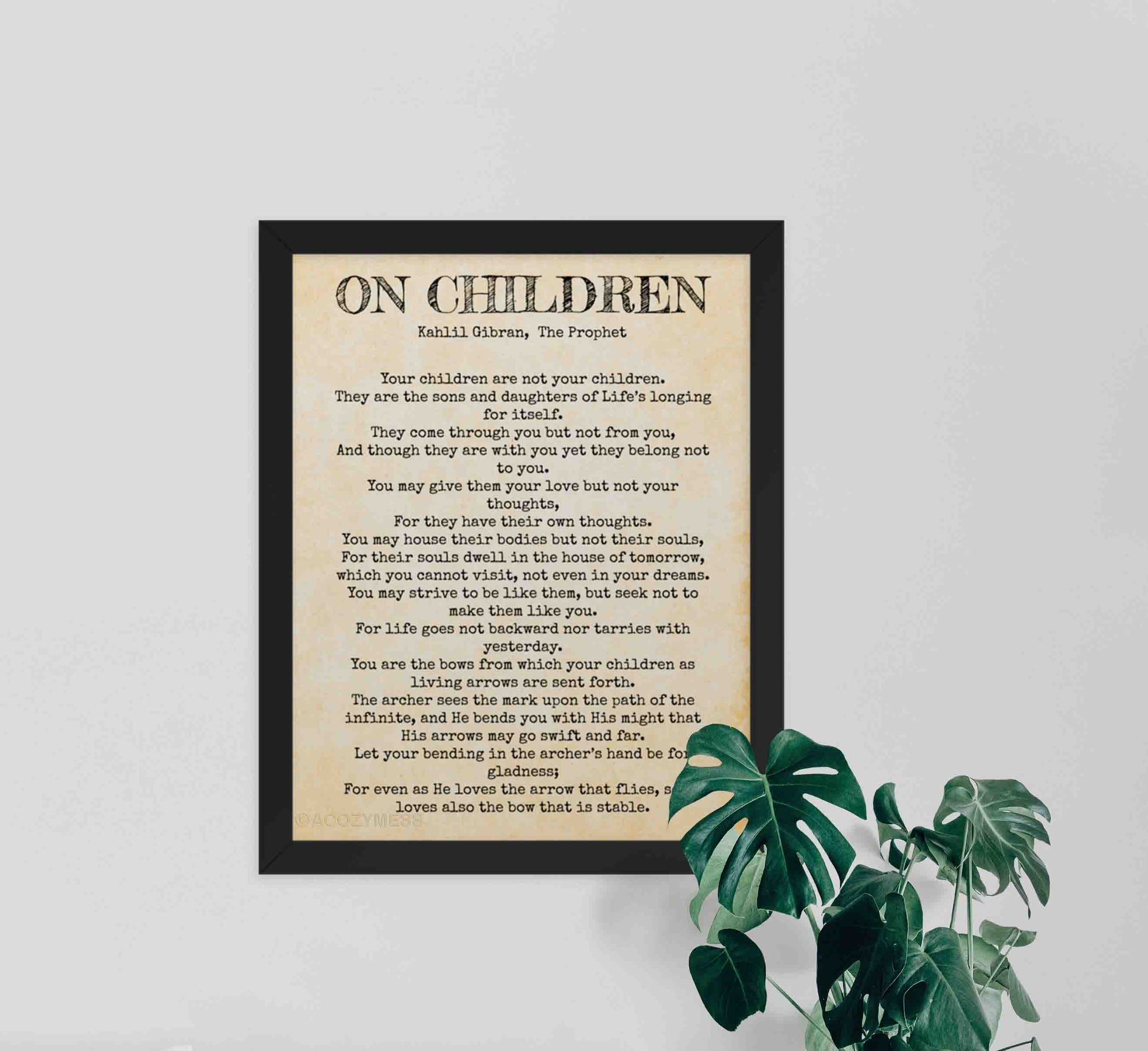 On Children by kahlil gibran poem black on rustic paper texture framed in black.