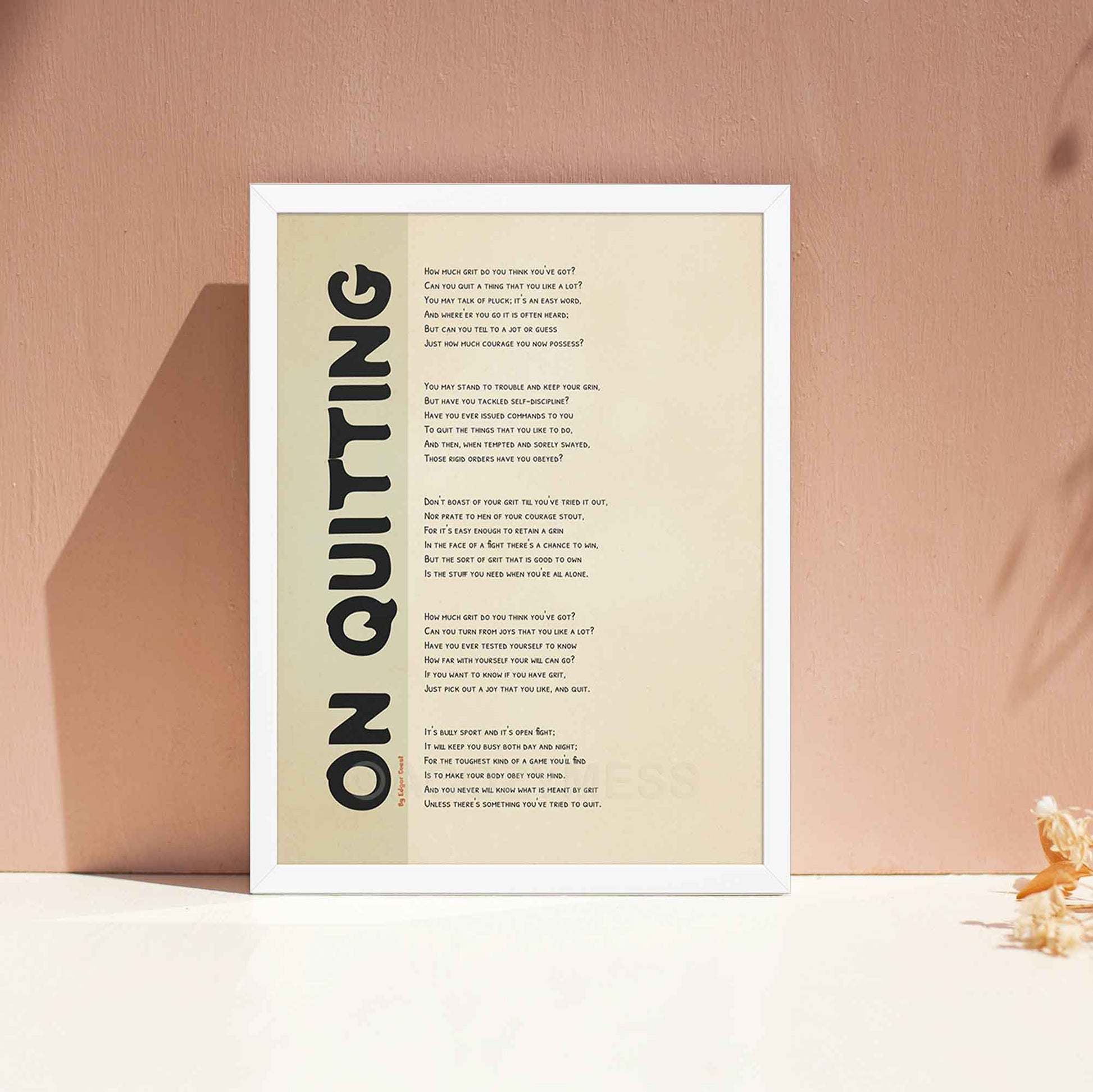 On Quitting poem poster, in white frame.