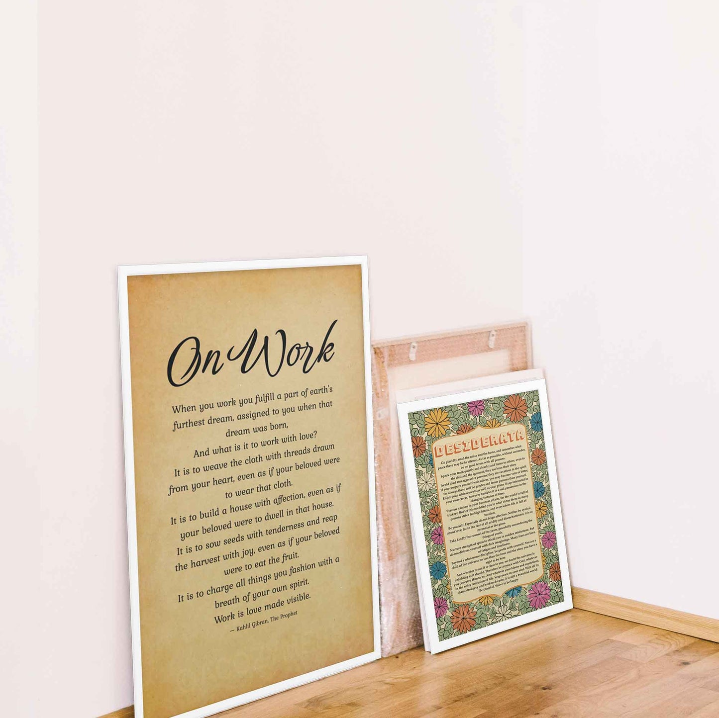 Kahlil Gibran on work poster from book the prophet, black on old paper beige background displayed in white frame. And desiderata poster in white frame