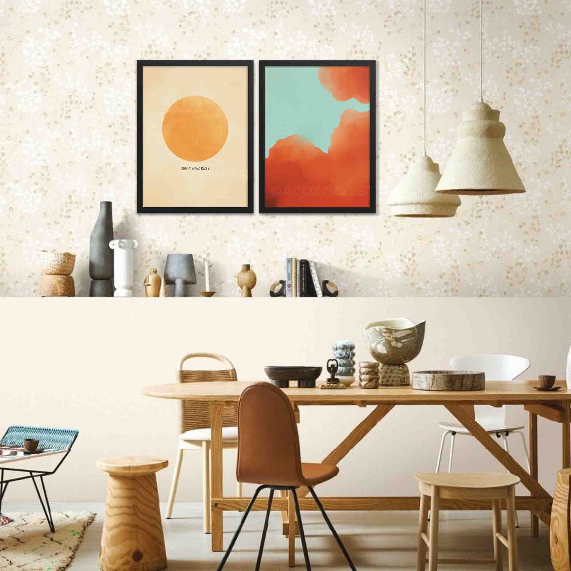 Illustrated art poster featuring vibrant orange-hued clouds against a serene blue sky in a black frame on a wall.