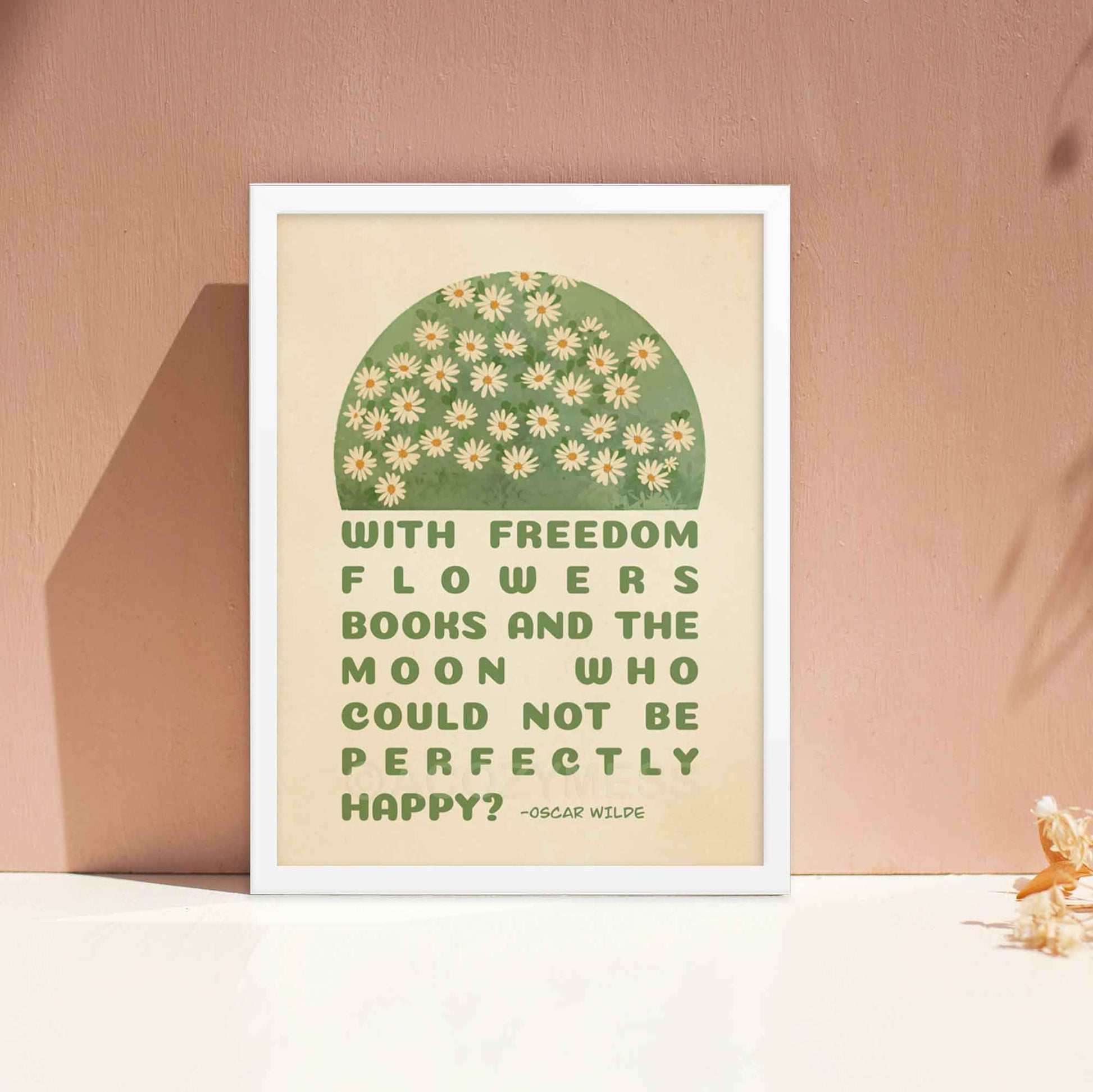 Poster featuring Oscar Wilde's quote, With freedom, flowers, books, and the moon, who could not be perfectly happy? with a delicate design of white flowers on green and beige, displayed in white frame.