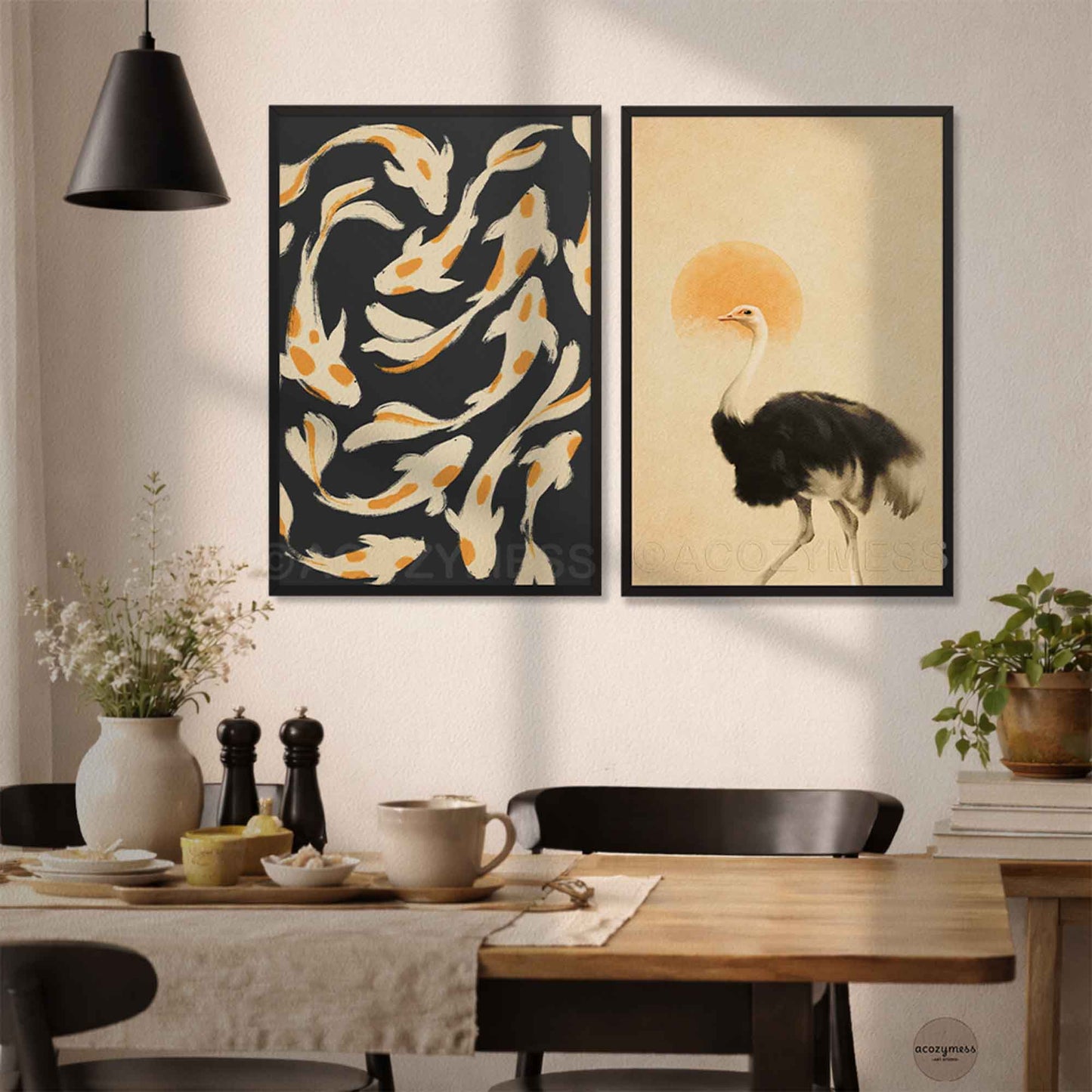 Two framed wall art prints displayed above a dining table in a styled room. The left print shows abstract koi fish in white, orange, and black on a dark background. And Ostrch Bird wall art decor.