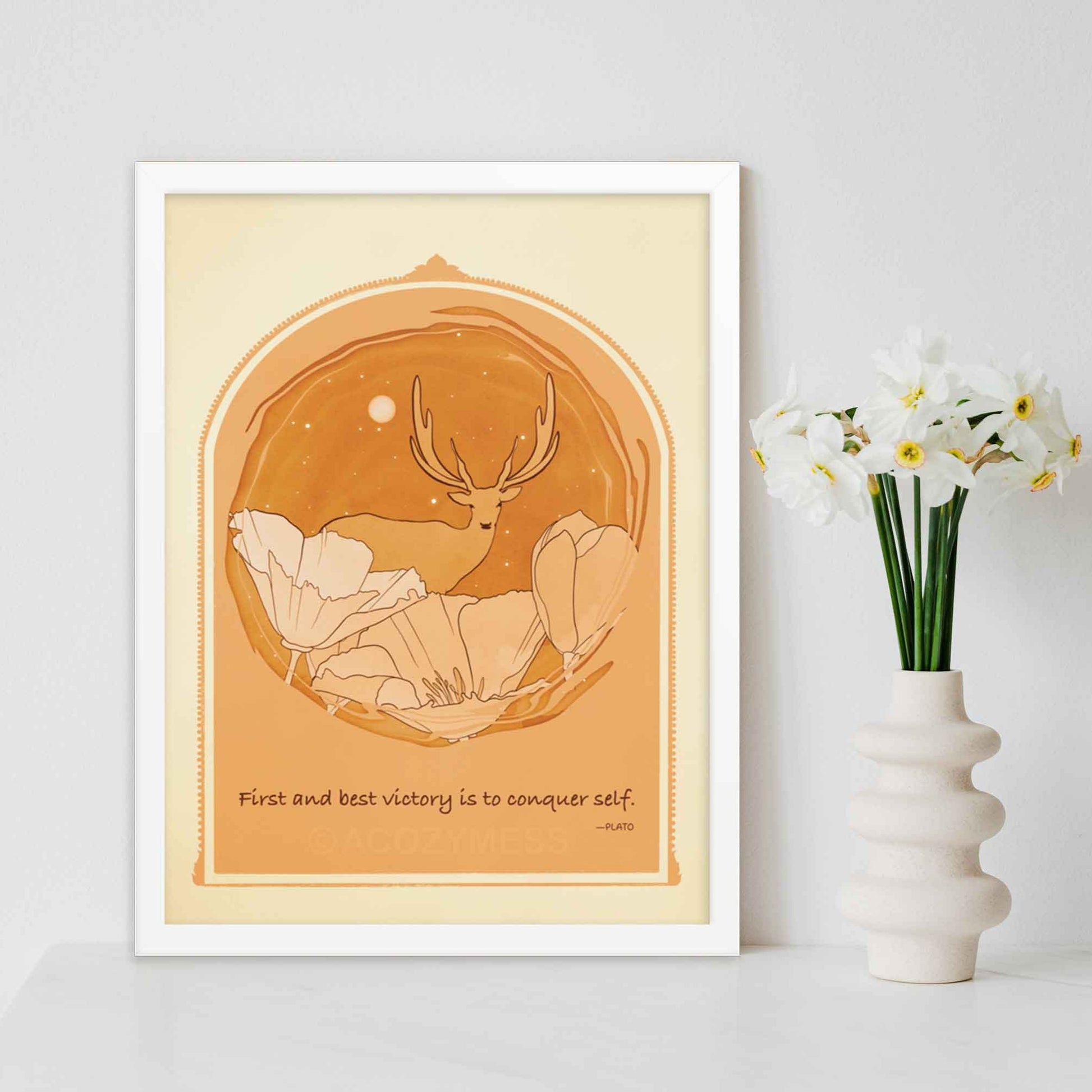 Art print featuring Plato's quote 'The first and best victory is to conquer self' alongside an illustration of a deer among flowers, done in yellow, orange and brown, framed in white