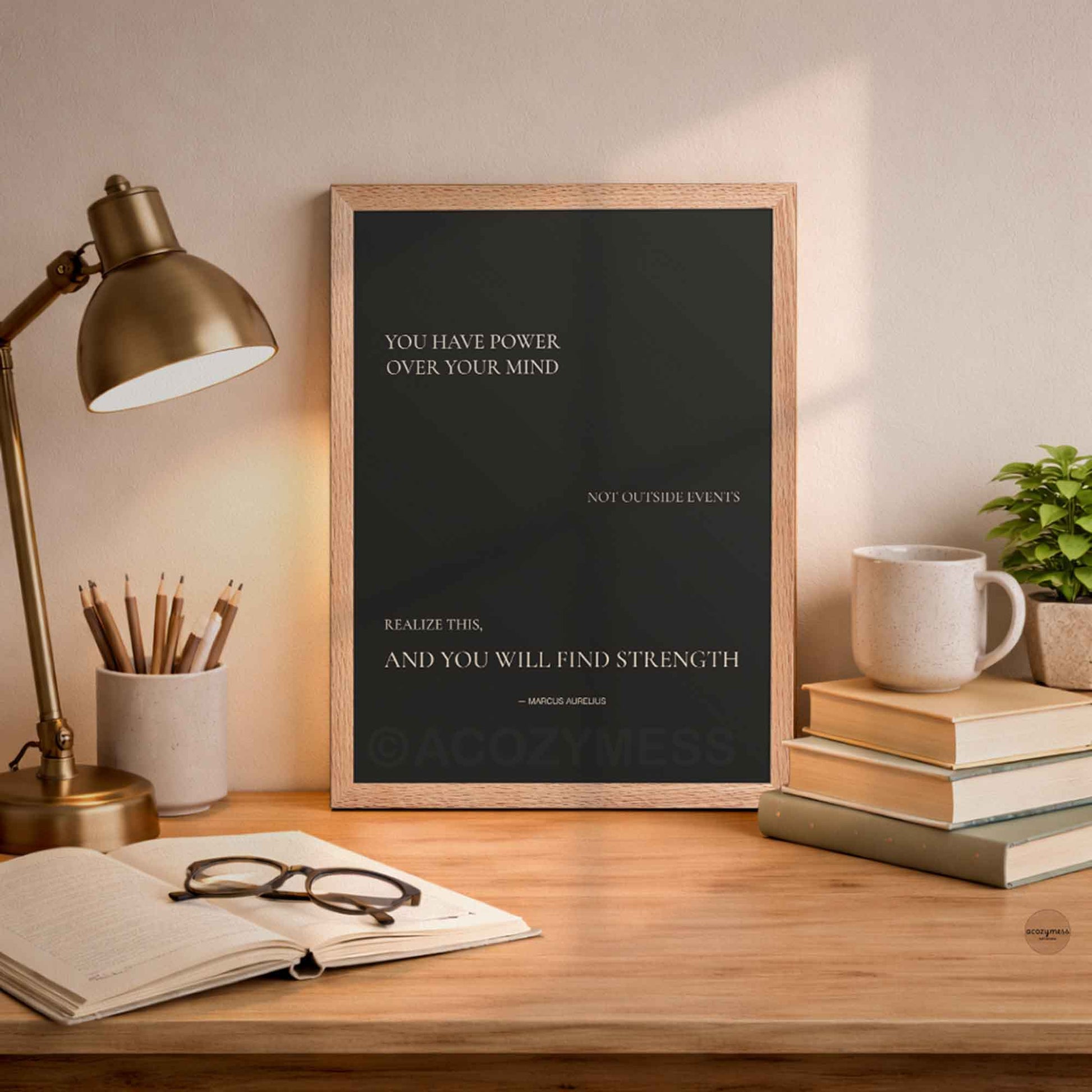 Oakwood Framed motivational poster Minimalist design with Marcus  Aurelius quote on dark background on a desk.