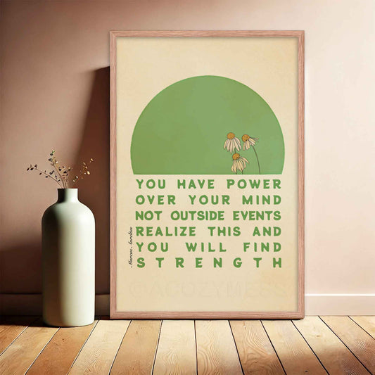 Stoic-inspired poster featuring Marcus Aurelius quote, You have power over your mind not outside events. Realize this, and you will find strength, with a green and beige floral design, displayed in a oakwood frame.