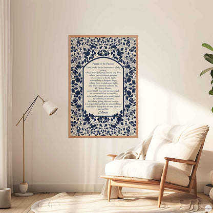 Prayer of St. Francis print in a warm oakwood frame, with a botanical blue design on a  light beige backdrop for mindful spaces.