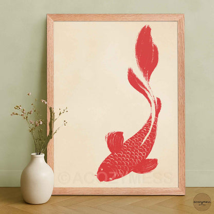 Framed artwork of a red fish on a beige background.