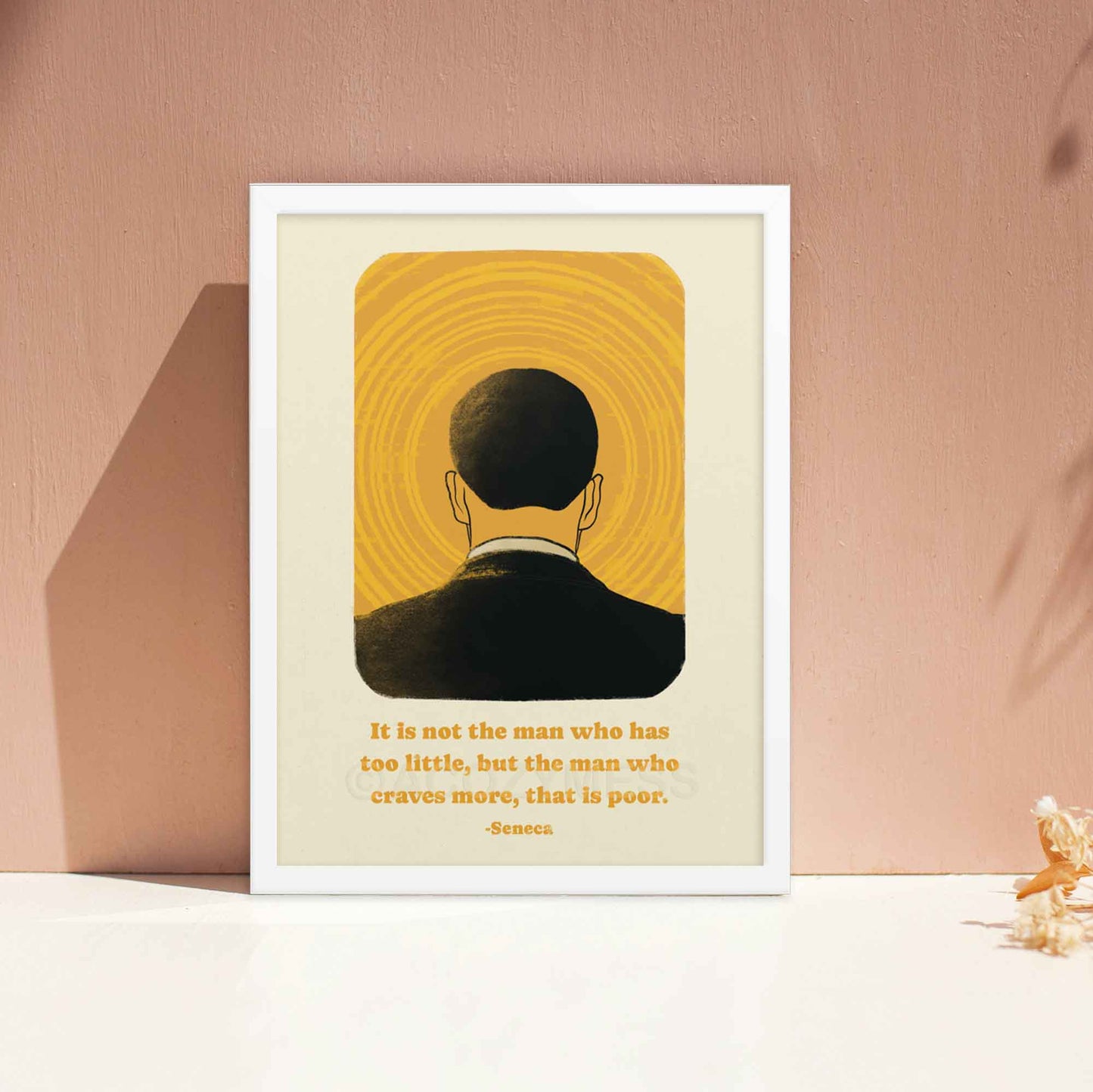 Art poster depicting the back of a man's head against a vibrant yellow background with concentric circles emanating from the center, resembling a halo or sun. Below the image is a quote by Seneca in elegant, readable font that reads, "It is not the man who has too little, but the man who craves more, that is poor." 